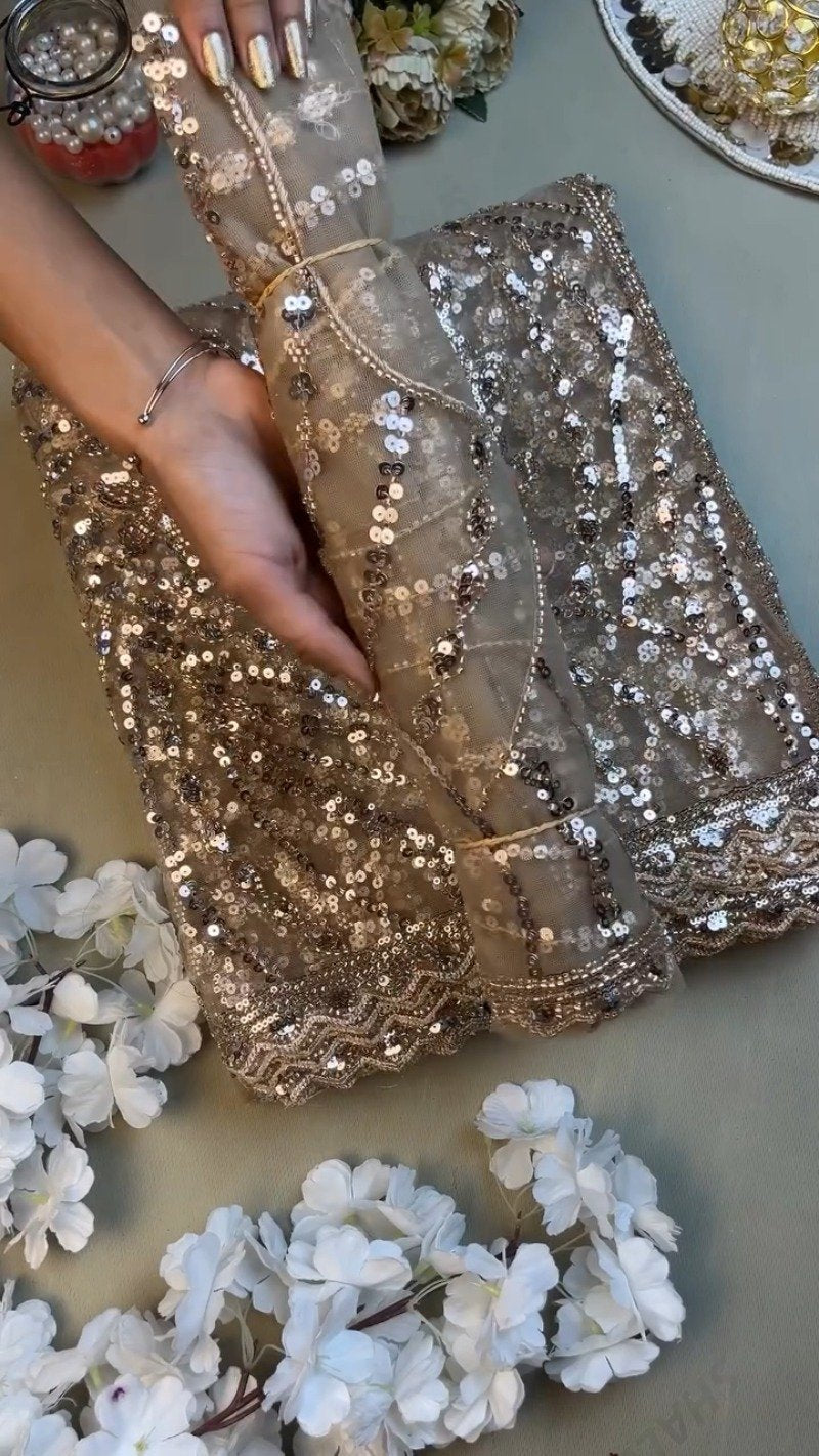 Opulent Champagne Shimmer Sequin-Embellished Net Saree – A Masterpiece of Glitz