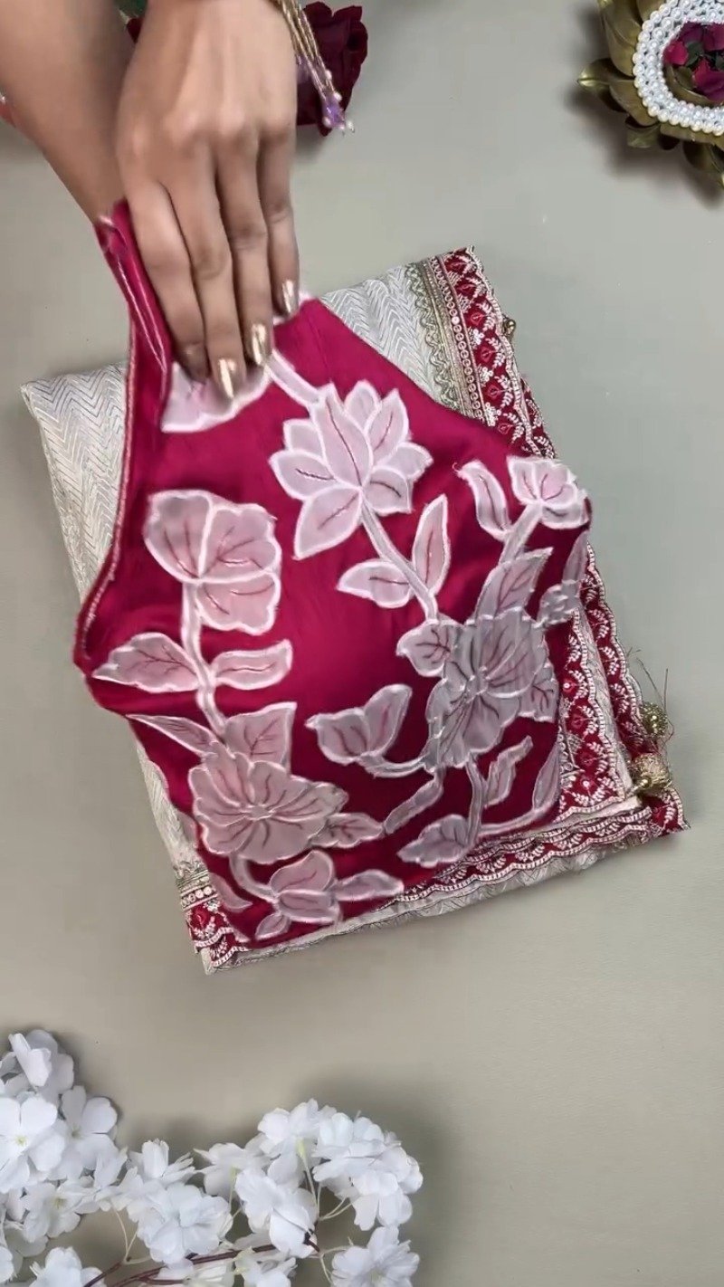 Ivory Chevron Pattern Saree with Embellished Deep Magenta Blouse – Elegant Festive Drape