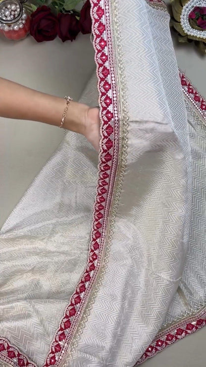 Ivory Chevron Pattern Saree with Embellished Deep Magenta Blouse – Elegant Festive Drape