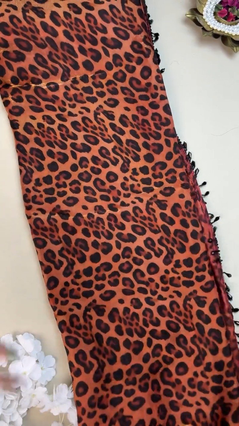 Sultry Leopard Print Organza Saree with Embellished Sequin Blouse
