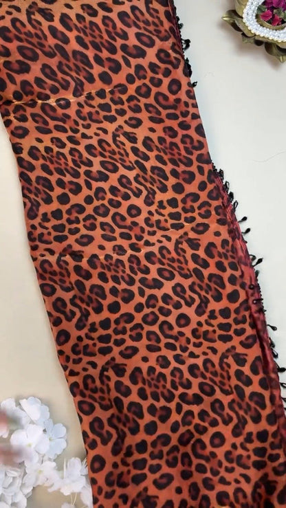 Sultry Leopard Print Organza Saree with Embellished Sequin Blouse