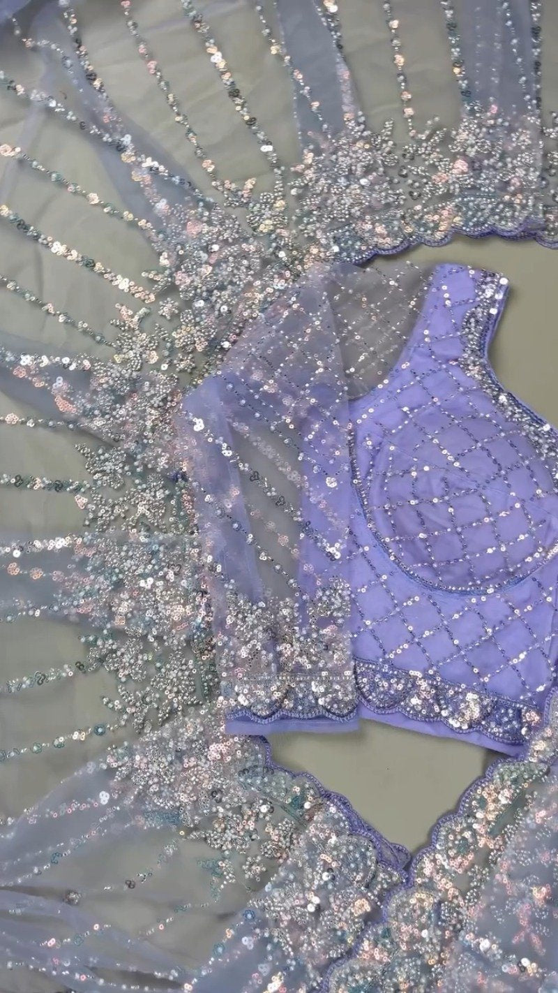 Enchanting Lavender Sequined Net Saree with Intricate Diamond-Grid Blouse