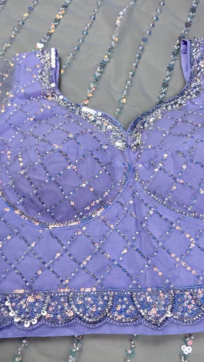 Enchanting Lavender Sequined Net Saree with Intricate Diamond-Grid Blouse