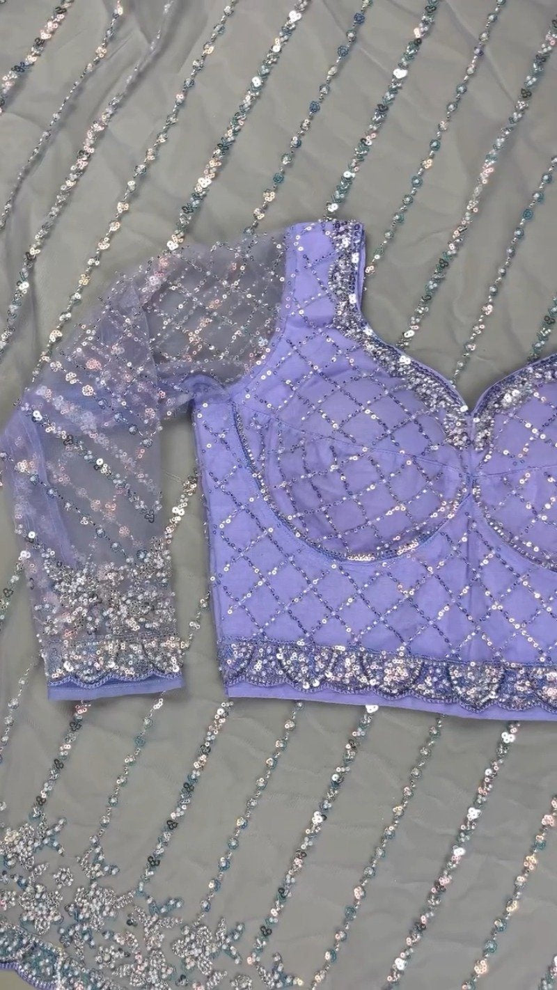 Enchanting Lavender Sequined Net Saree with Intricate Diamond-Grid Blouse