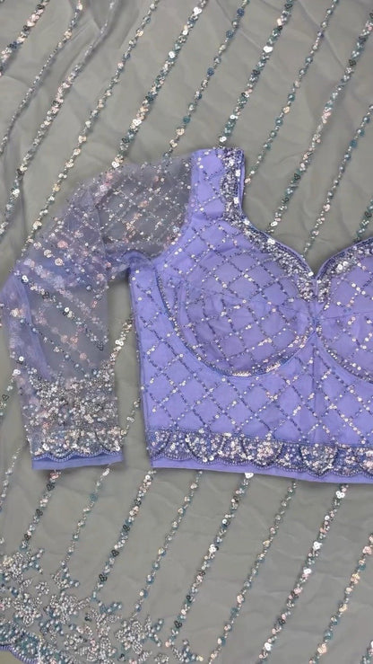 Enchanting Lavender Sequined Net Saree with Intricate Diamond-Grid Blouse