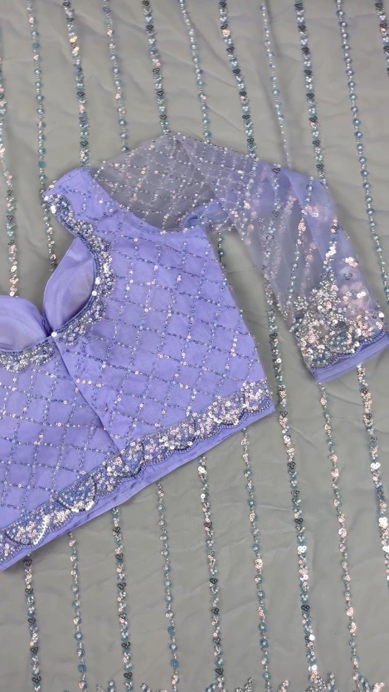 Enchanting Lavender Sequined Net Saree with Intricate Diamond-Grid Blouse